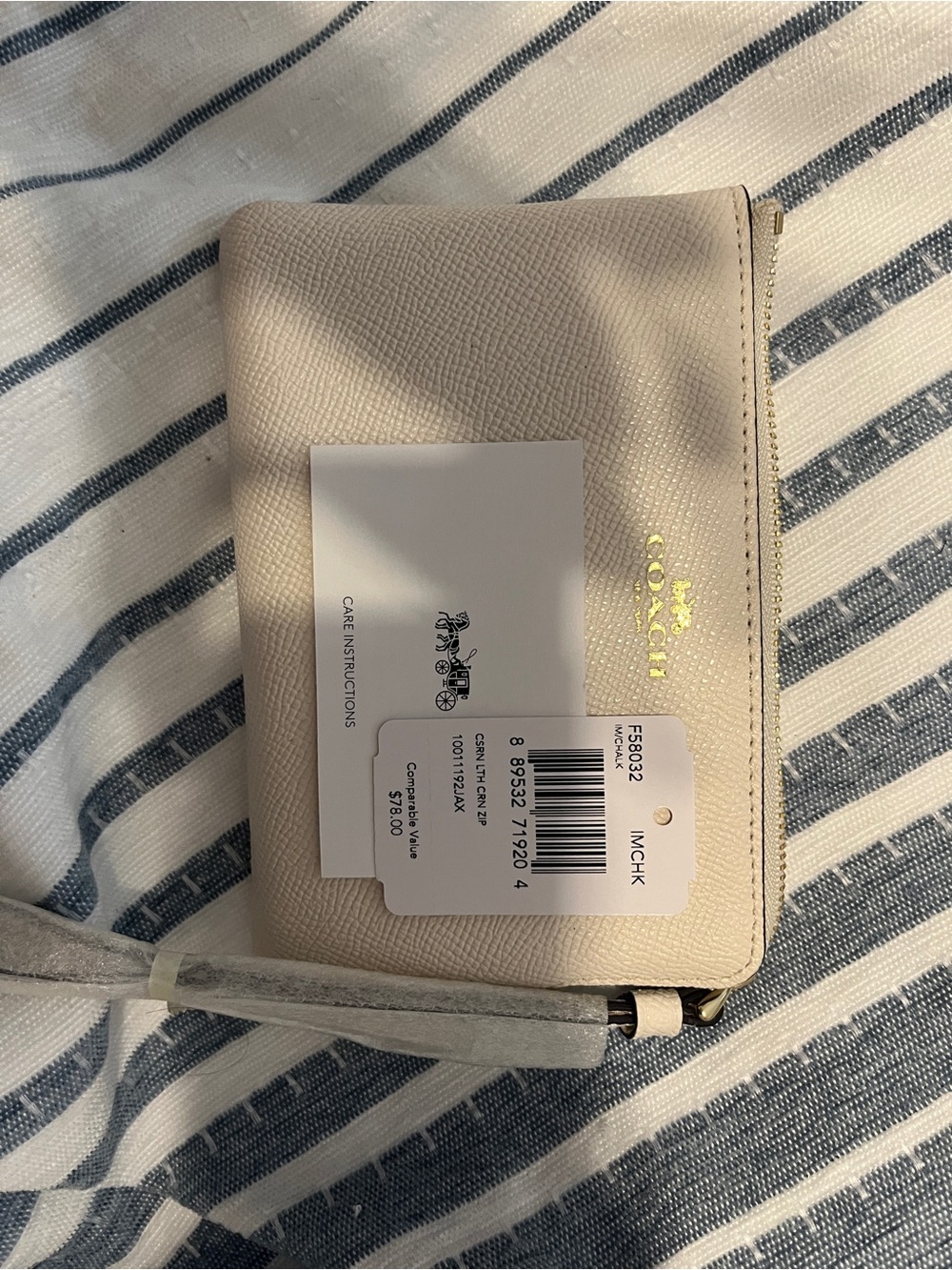 Coach Wristlet in chalk color Pebbled Leather with Gold Logo